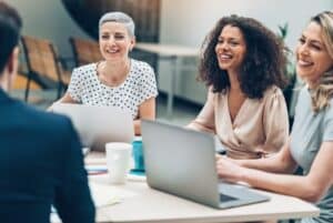 female leaders sitting around a table