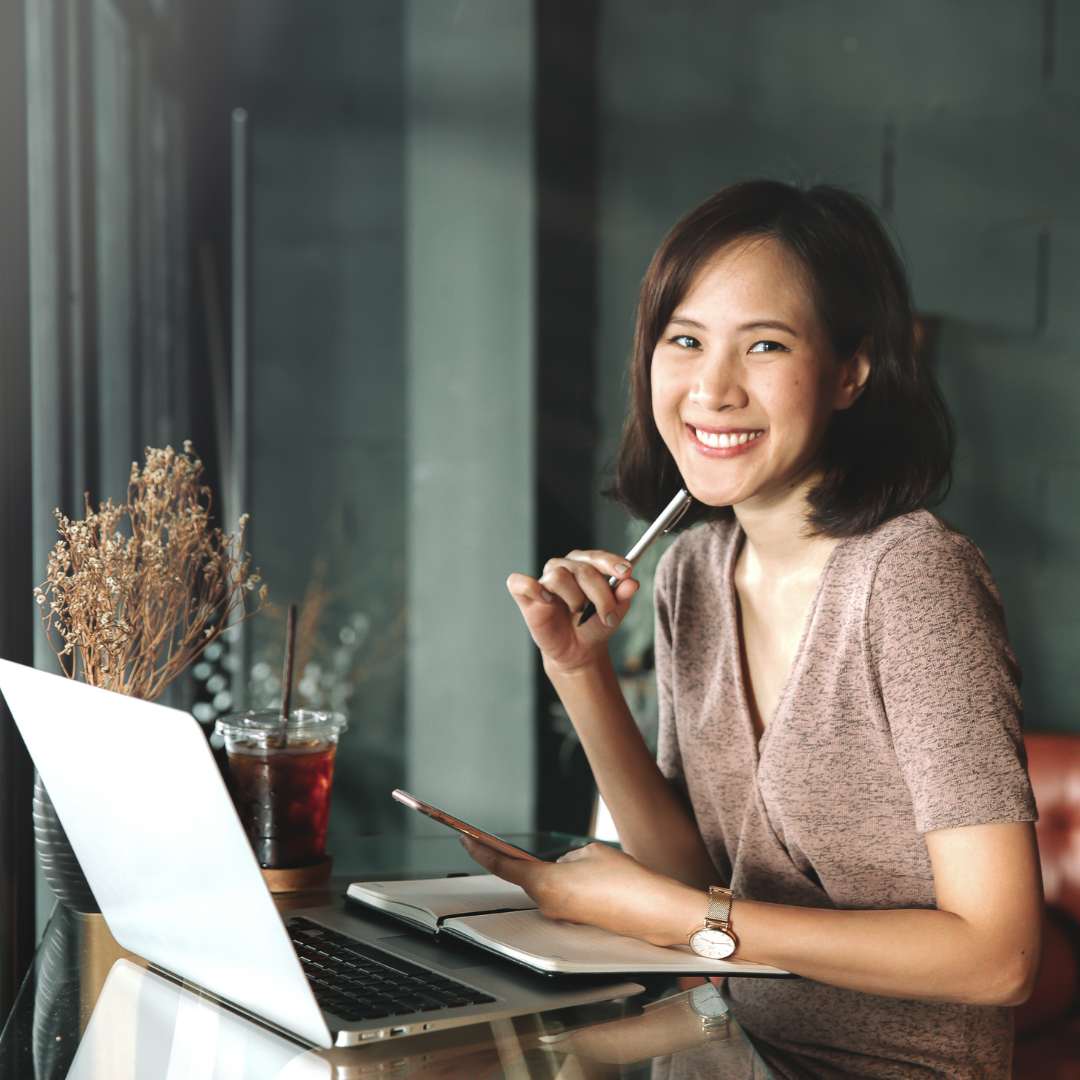 Women smiling with laptop