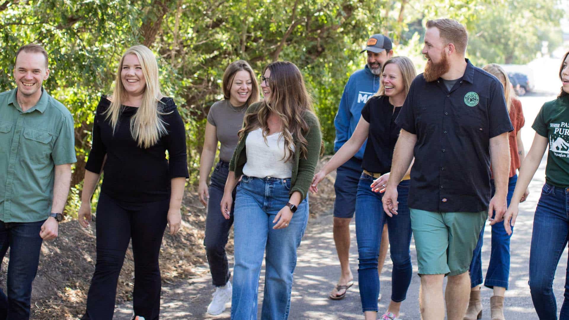 happy employees walking in the shade