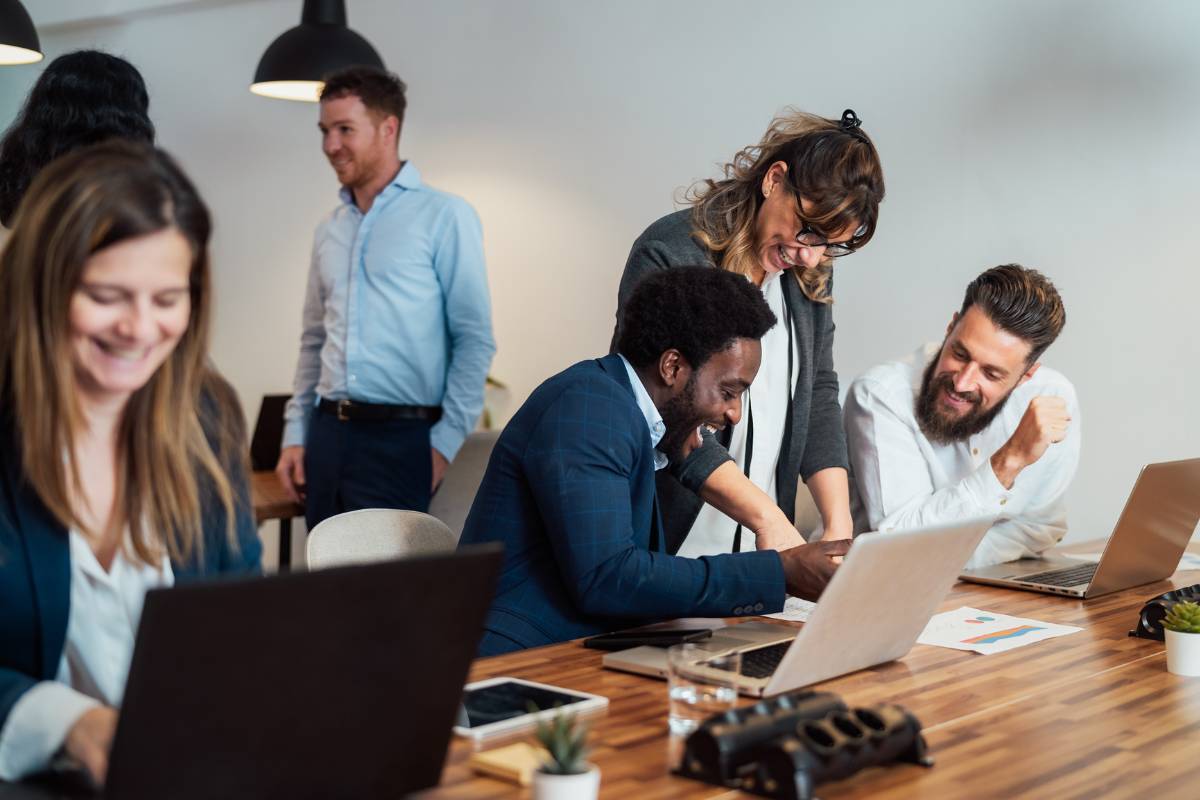 happy team members who use talent dynamics in the workplace