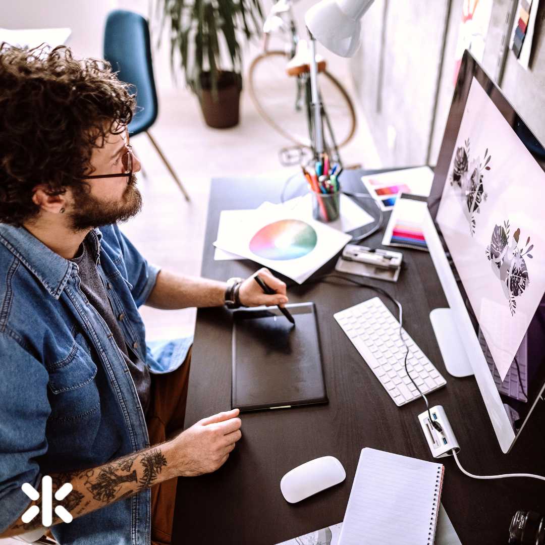 male illustrator working on a computer