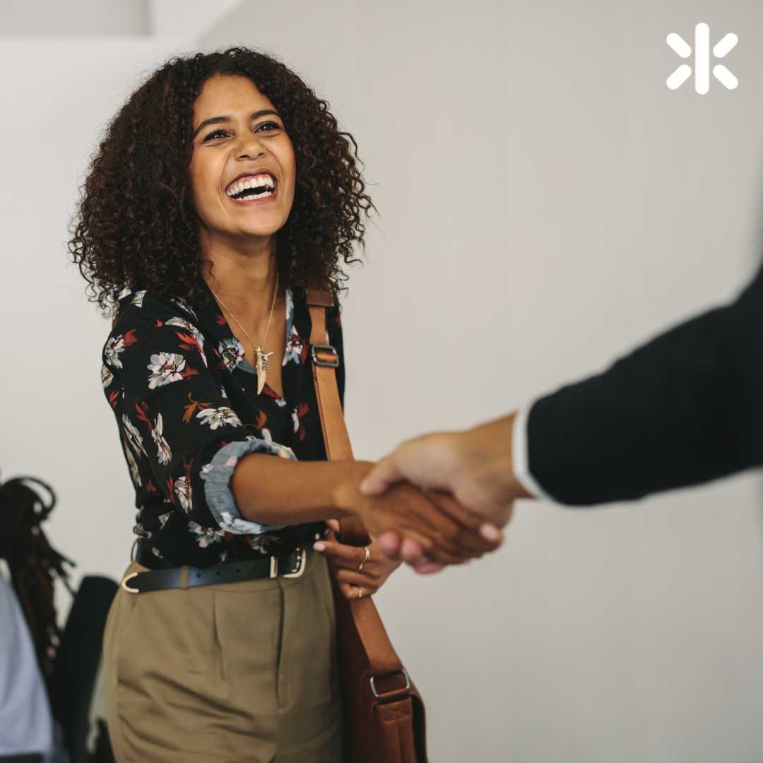 female professional shaking hands with someone