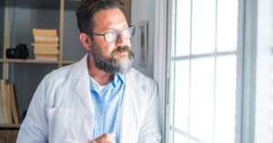Dentist thinking about the future of his dental practice