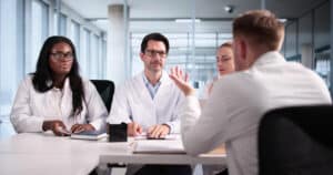 Dental team having a monthly meeting to discuss practice growth and sustainability