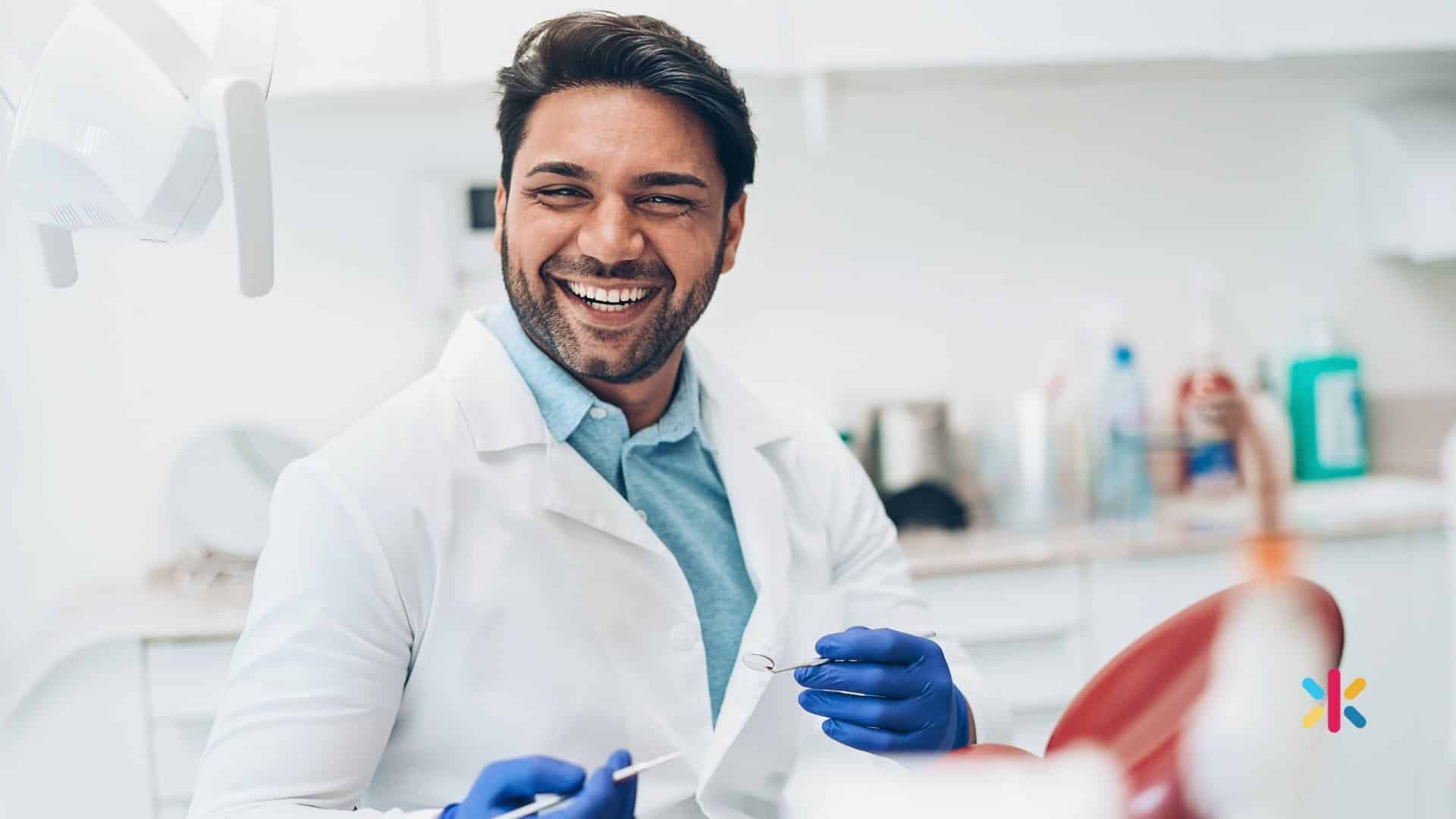 Smiling dentist in a Flagstaff Arizona dental office representing strong team culture and leadership developed through dental coaching