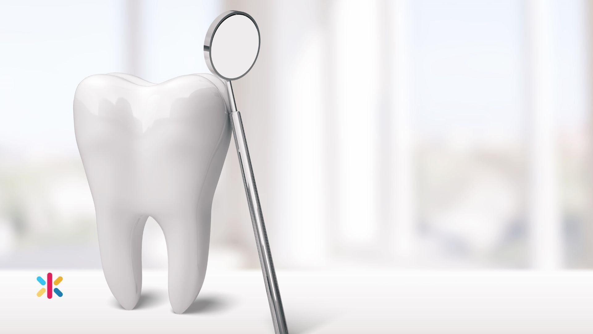 White tooth model with dental mirror tool representing oral health and dental care