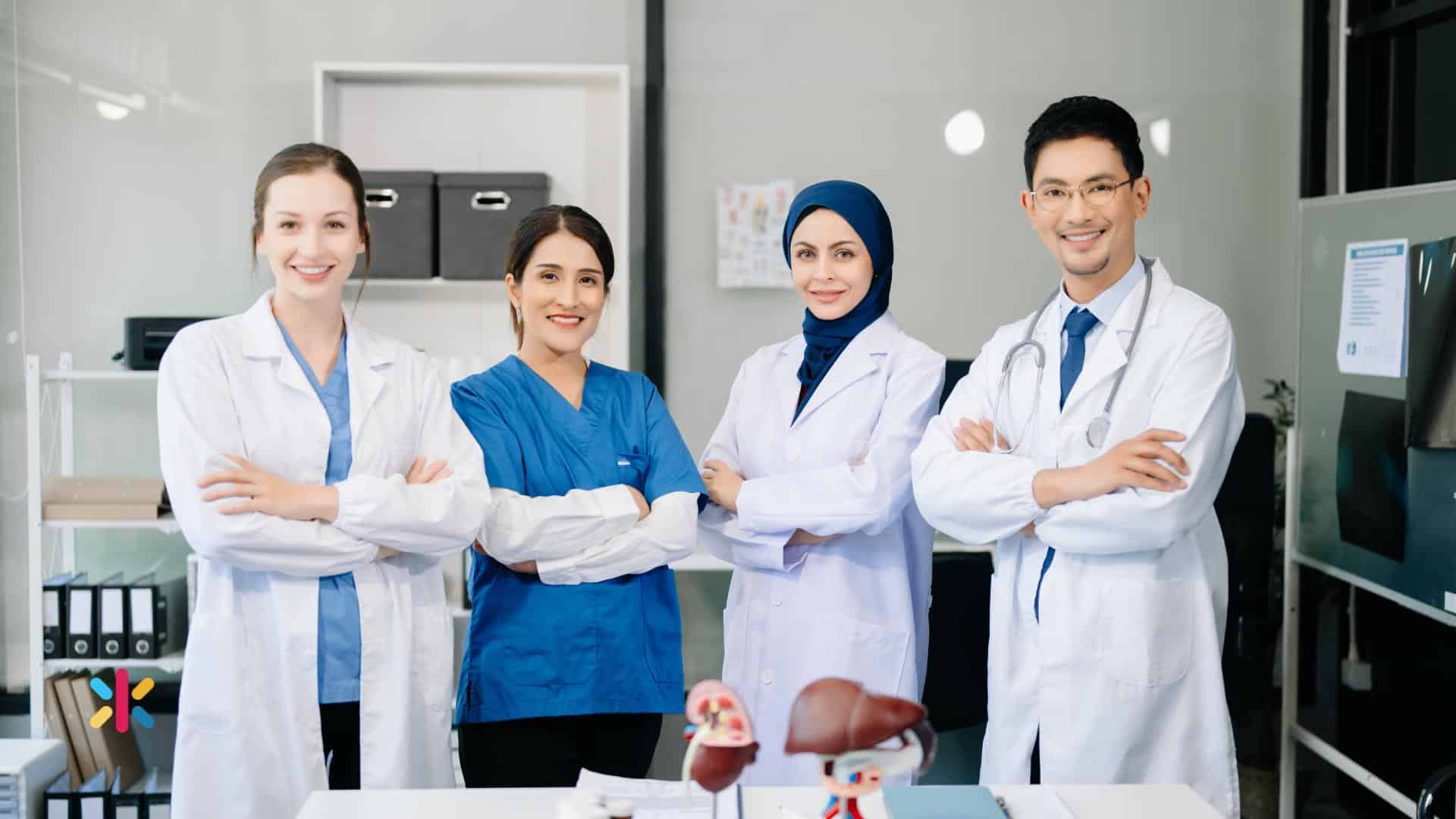 Healthcare team of doctors and medical staff standing together in a clinic representing teamwork and leadership in healthcare.
