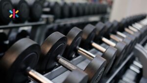 Gym weights representing how discipline, consistency, and small daily improvements build stronger leadership skills.